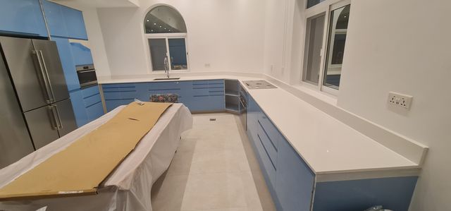 Kitchen cabinets with stone worktops
