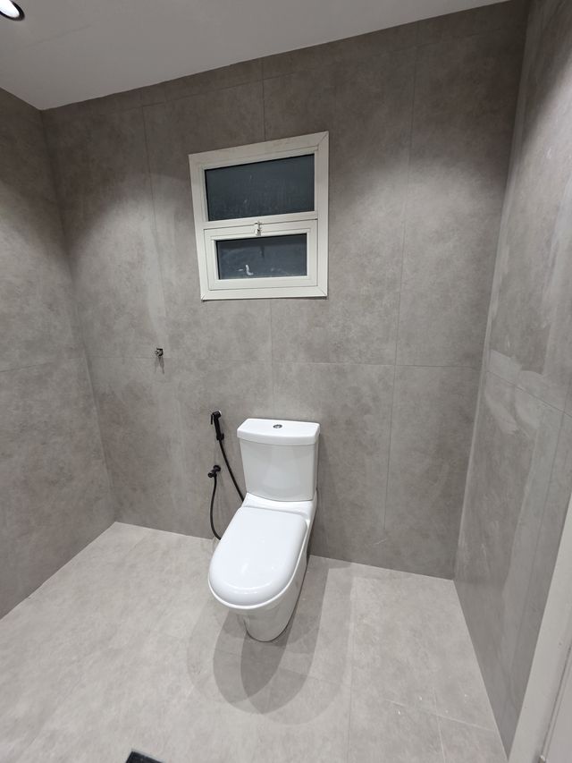 Grey shower rooms with black fittings
