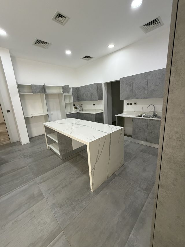 Kitchen with a marble-look island