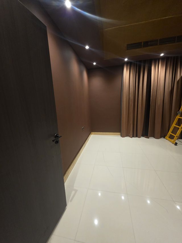 Dark wood wall panelling with brass trims: finished