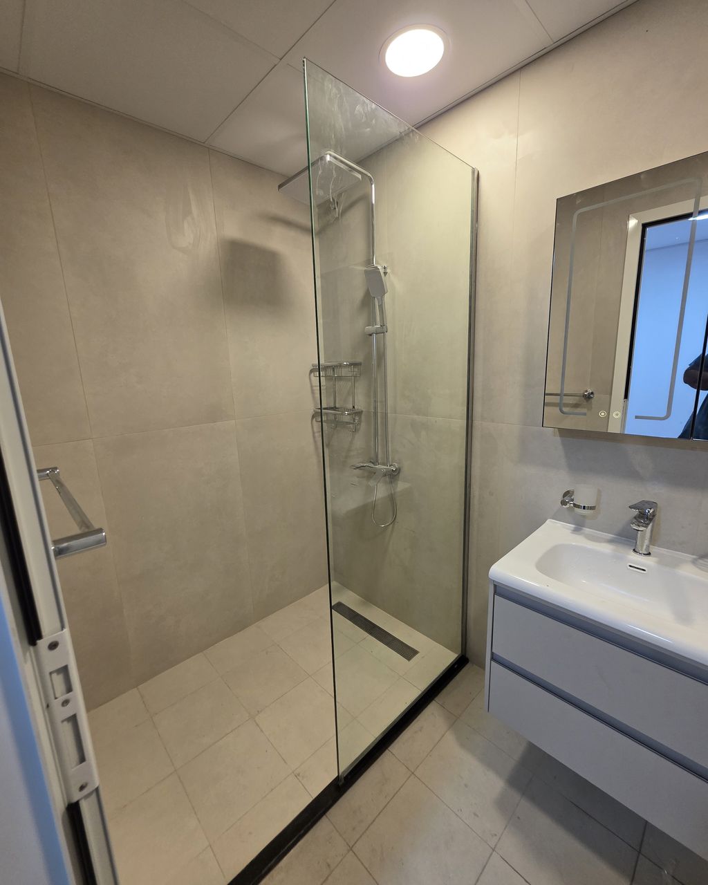 After: Bathroom finished with a glass shower