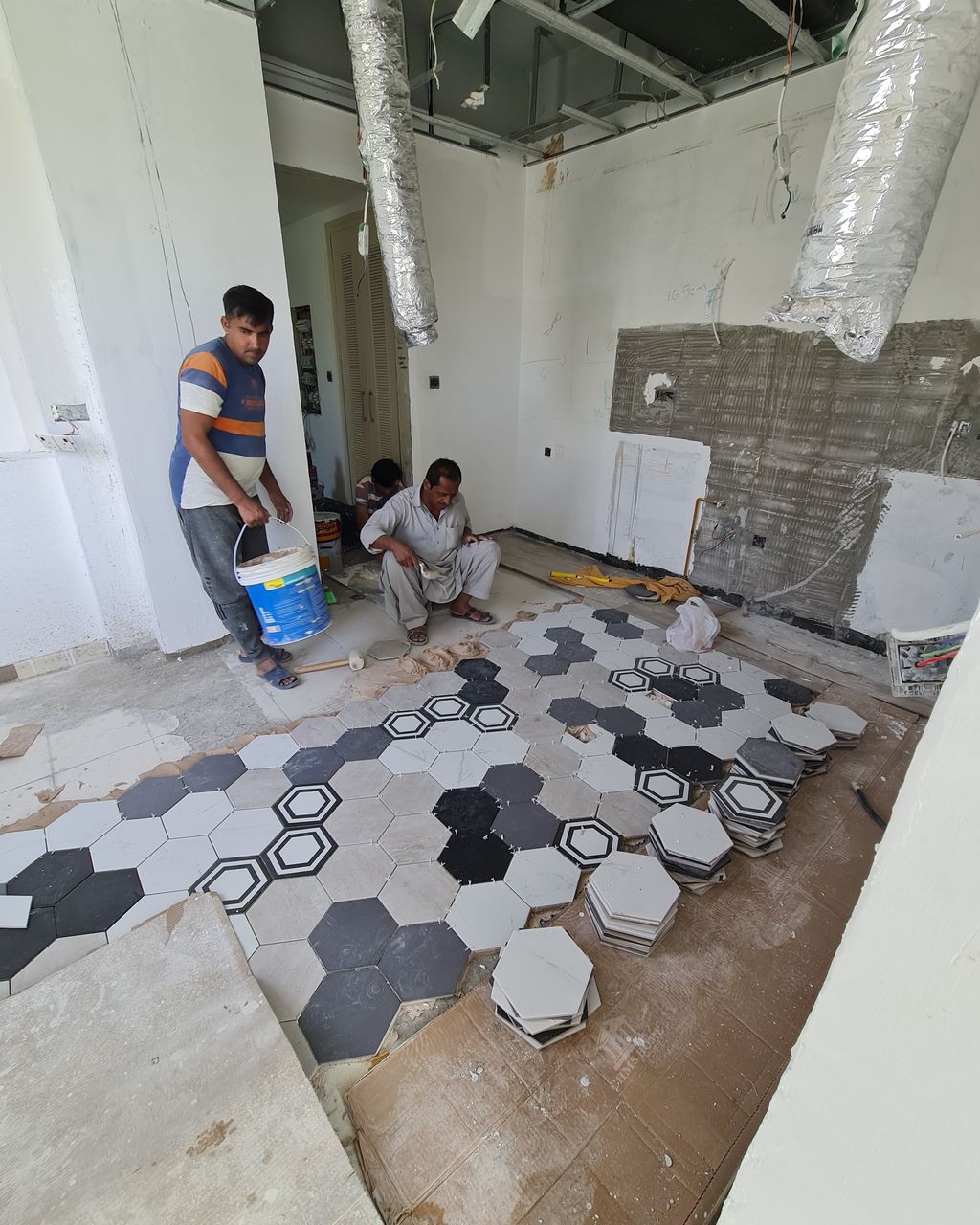 Before: Kitchen fit-out with a hexagon tile floor