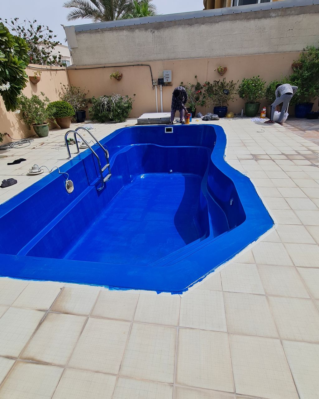 After: Faded pool repainted